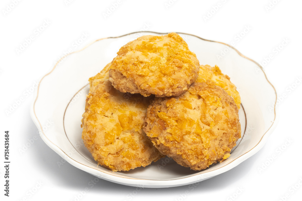 Cornflakes cookies in a small white plate isolated on white background clipping path Cornflakes cookies in a small white plate isolated on white background clipping path