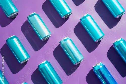 A row of blue cans are arranged in a pattern on a purple background. The cans are all the same color and size, creating a sense of uniformity and order. The image conveys a feeling of organisation. photo