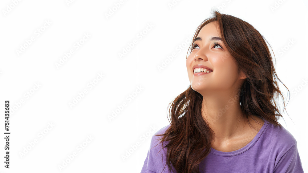 Asian woman wearing purple shirt smile looking up isolated on gray Asian woman wearing purple shirt smile looking up isolated on gray