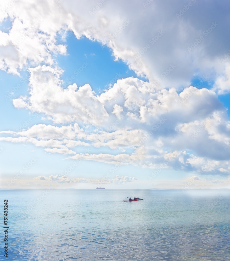 Ocean, blue sky and people on kayak for adventure, sports and travel on natural background or landscape. Sea, fresh air and clouds with calm water, boat on journey and recreation activity for holiday