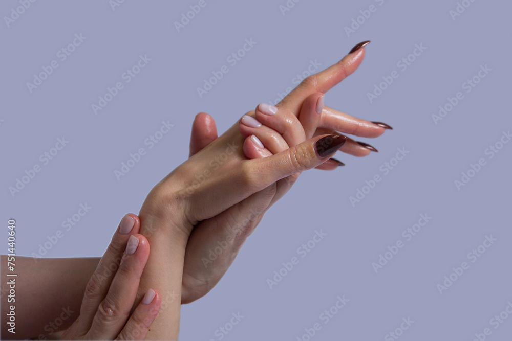 The masseuse massages the client's palms. Close-up of hands during spa treatments.isolated,on a plain background The masseuse massages the client's palms. Close-up of hands during spa treatments.isolated,on a plain background