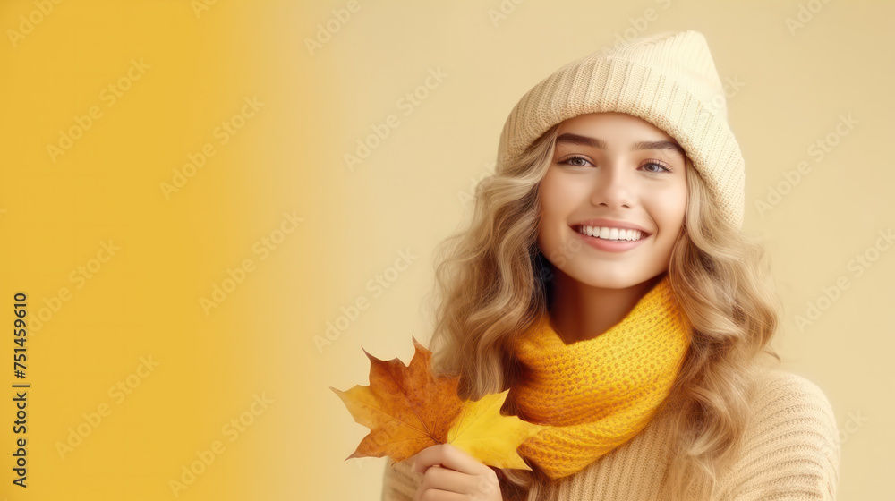 Autumn portrait of beautiful happy smiling young woman with yellow maple leaves wearing a french beret hat and jacket on gray background Autumn portrait of beautiful happy smiling young woman with yellow maple leaves wearing a french beret hat and jacket on gray background