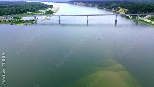 Aerial drone footage of the Bridge crossing over the River Semi trucks crossing the bridge