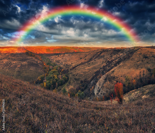 Rainbow with clouds over a rock. nature of Ukraine © sergnester