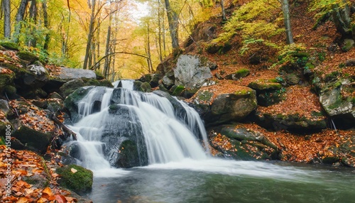 waterfall in autumn forest © Wayne