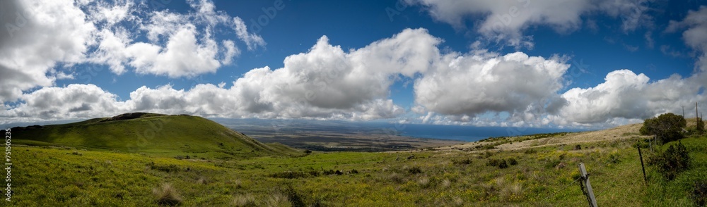 Panoramic view of a landscape of big island with big clouds Panoramic view of a landscape of big island with big clouds