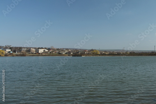 A body of water with buildings in the background