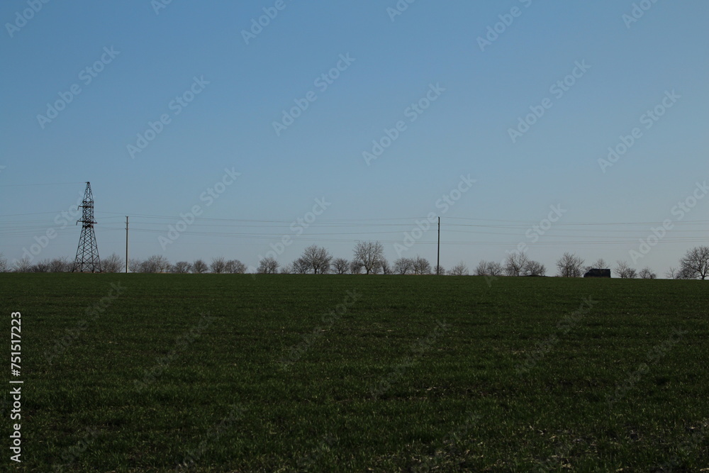 A power line tower in a field