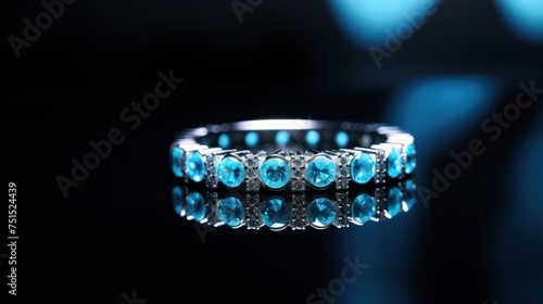 Wedding ring with blue gems on a dark background close up. Wedding content with Copy Space.