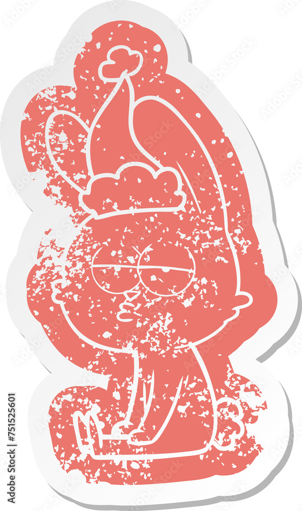 cute cartoon distressed sticker of a rabbit wearing santa hat