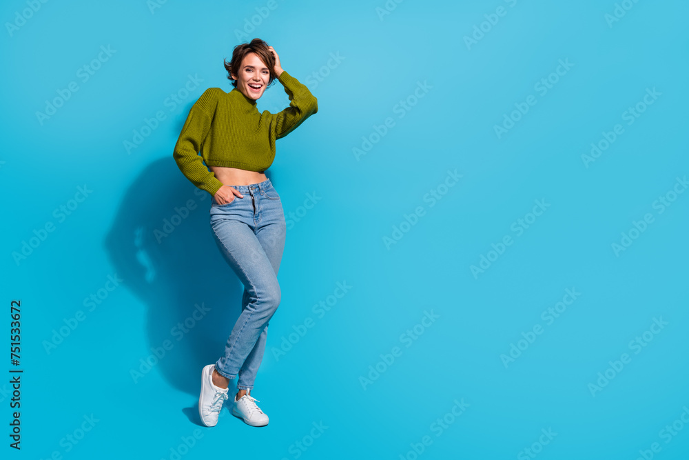 Full length photo of gorgeous cute girl wear trendy outfit standing empty space isolated on cyan color background - obrazy, fototapety, plakaty 