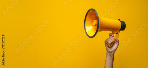 Hand holding a megaphone announces sales and discounts, on a vibrant yellow background. Marketing and commercial concept banner with copy space, made with Generative AI.