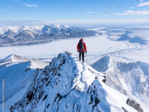 Mountaineer Trekking on Snow-Capped Ridge © Panisa