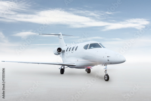 Modern white executive jet plane isolated on bright background with sky