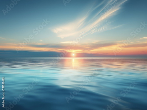 A beautiful blue ocean with a sun setting in the background