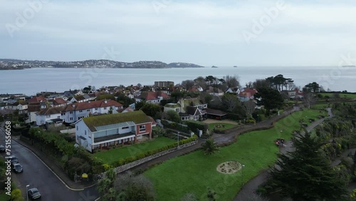 Paignton, Torbay, South Devon, England: DRONE VIEWS: The drone flies over the suburb of Roundham and shears towards Paignton Harbour and Pier. Torbay is a popular English holiday resort (Clip 6). photo