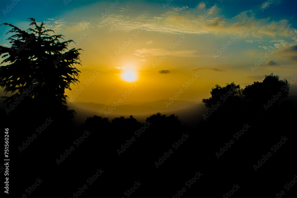 Sunset view from the mountains of Lansdowne. Mountain Sunset view in Lansdowne. Amazing  golden sunset seen through forest drive, Lansdowne Uttarakhand.