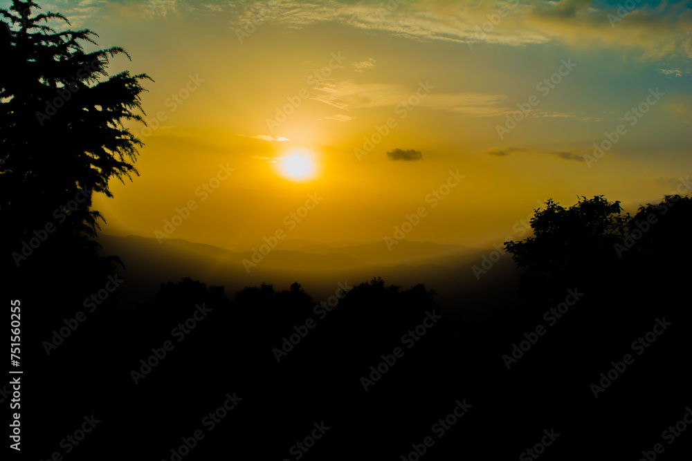 Sunset view from the mountains of Lansdowne. Mountain Sunset view in Lansdowne. Amazing  golden sunset seen through forest drive, Lansdowne Uttarakhand.