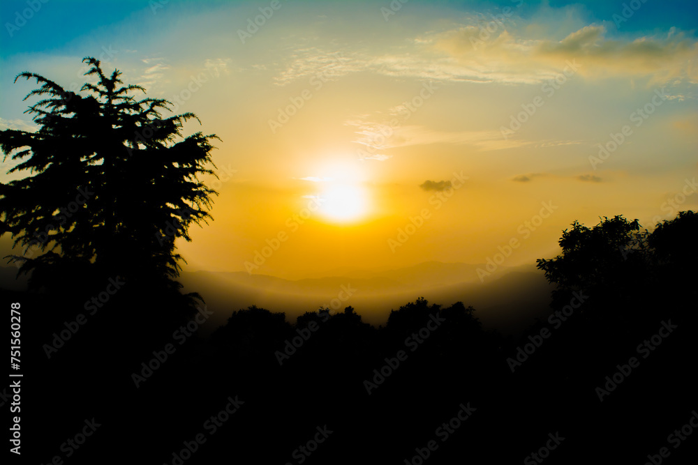 Sunset view from the mountains of Lansdowne. Mountain Sunset view in Lansdowne. Amazing  golden sunset seen through forest drive, Lansdowne Uttarakhand.