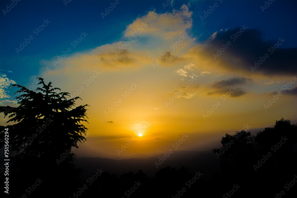 Sunset view from the mountains of Lansdowne. Mountain Sunset view in Lansdowne. Amazing  golden sunset seen through forest drive, Lansdowne Uttarakhand.