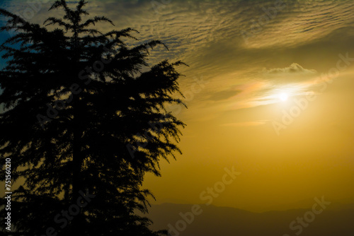 Sunset view from the mountains of Lansdowne. Mountain Sunset view in Lansdowne. Amazing  golden sunset seen through forest drive, Lansdowne Uttarakhand. photo