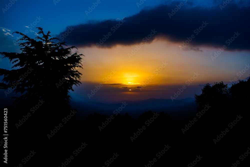 Sunset view from the mountains of Lansdowne. Mountain Sunset view in Lansdowne. Amazing  golden sunset seen through forest drive, Lansdowne Uttarakhand.