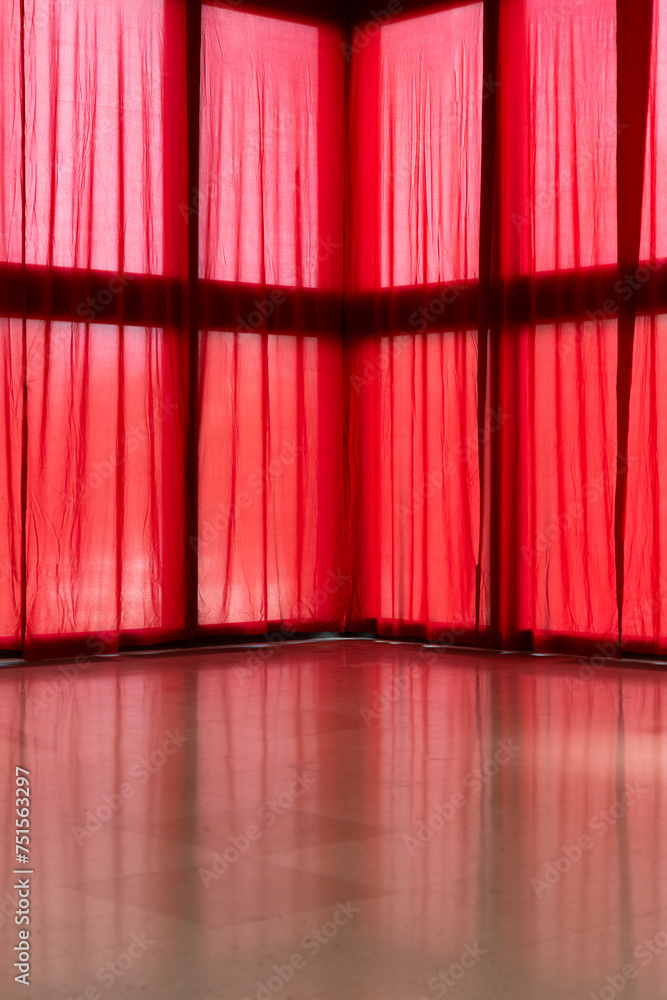 Red transparent curtains on big windows Red transparent curtains on big windows