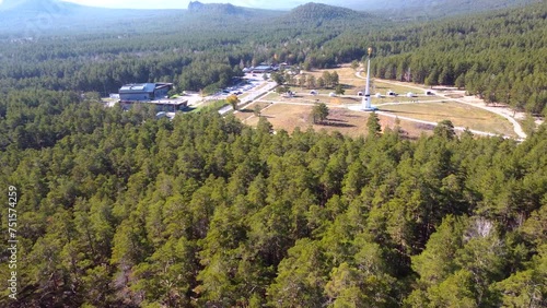 Aerial drone footage to the stunning nature of Borovoe, majestic cliffs with a pine forest, among which is the high stele of Ablai Khan. An atmospheric journey through Kazakhstan. photo