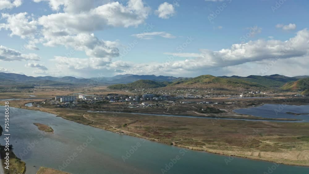 Flowing River in Lush Green Countryside. Russia, Dalnegorsk Flowing River in Lush Green Countryside. Russia, Dalnegorsk