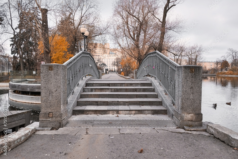 beautiful bridge over a pond in an autumn park beautiful bridge over a pond in an autumn park