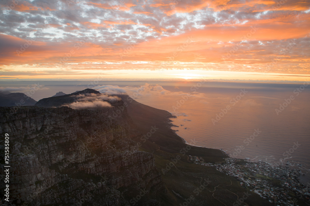 A view of Camp's Bay from Table Mountain, at sunset, looking over the suburba nd the ocean. Situated in Cape Town, South Africa