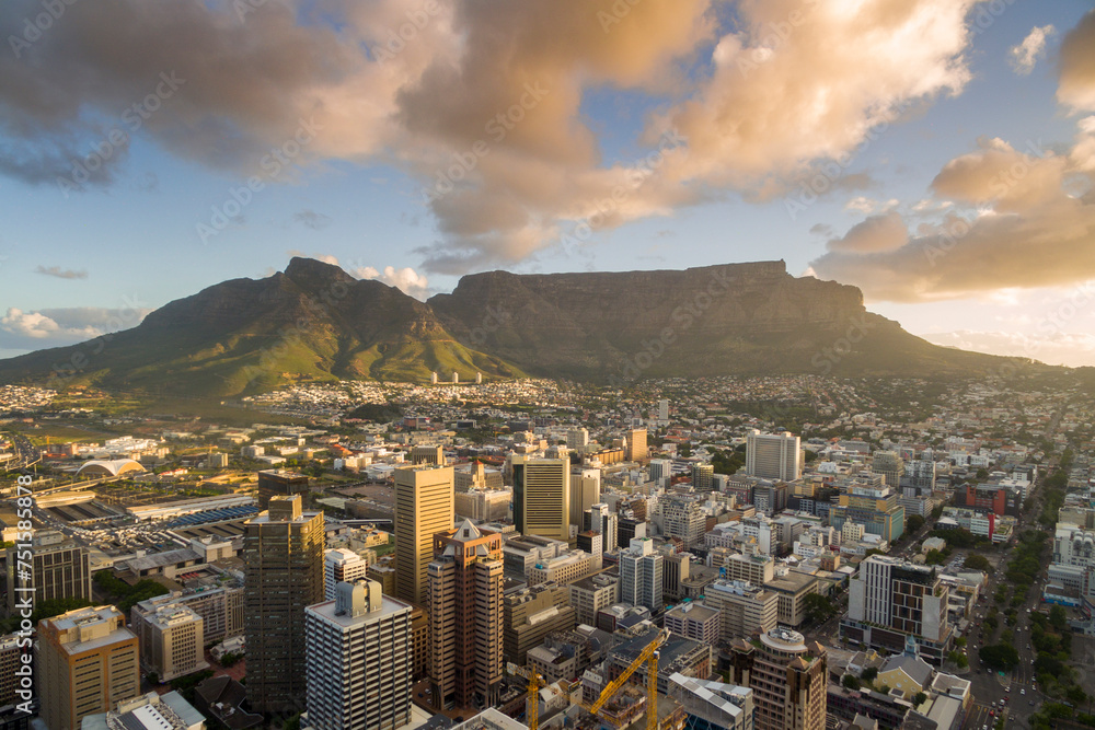 An aerial view of Cape Town central business district in late afternoon as the sun is setting, showing Table Mountain. - obrazy, fototapety, plakaty 