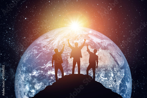 Silhouette of three people on the background of the planet, success concept. Elements of this image furnished by NASA