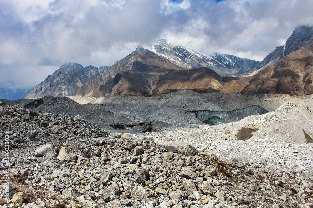 Ngozumpa Glacier, Nepal's largest glacier with massive debris, stone, ice and clay deposits, flows from Cho Oyu and is the headwaters of the Dudh Kosi that travels over 1500 kms to the Bay of Bengal