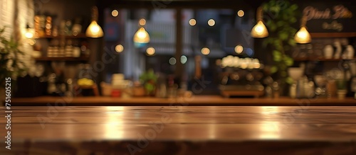 This image shows a blurry bar setting with lights shining in the background. The focus is on the lights creating a warm and inviting atmosphere in the bar.