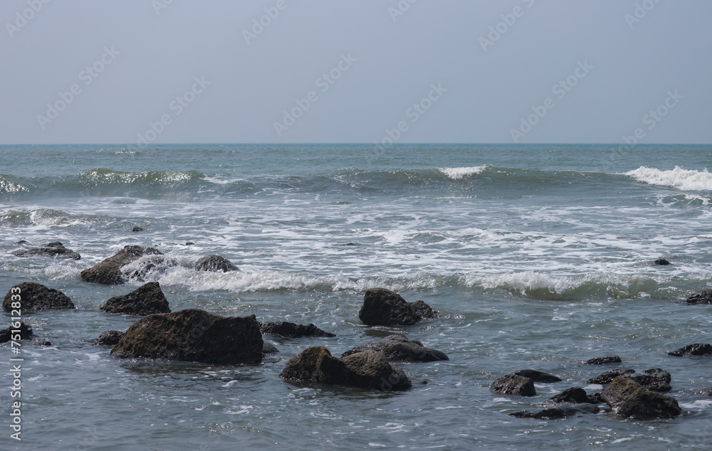waves crashing on rocks at Patuartek sea beach of Cox's Bazar, Bangladesh waves crashing on rocks at Patuartek sea beach of Cox's Bazar, Bangladesh