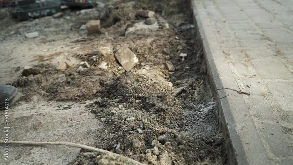 Worker Digs electric wires into the ground with a Shovel
Man digs a ditch in the ground with a shovel Worker Digs electric wires into the ground with a Shovel
Man digs a ditch in the ground with a shovel