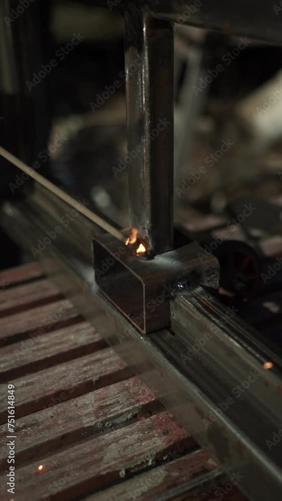 Welder Welds a metal pipe. Iron welding. Welding Sparks
Welder Welds a metal pipe. Iron welding. Welding Sparks