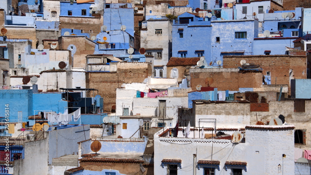 Blue and white buildings on a slope in the medina, in Chefchaouen, Morocco