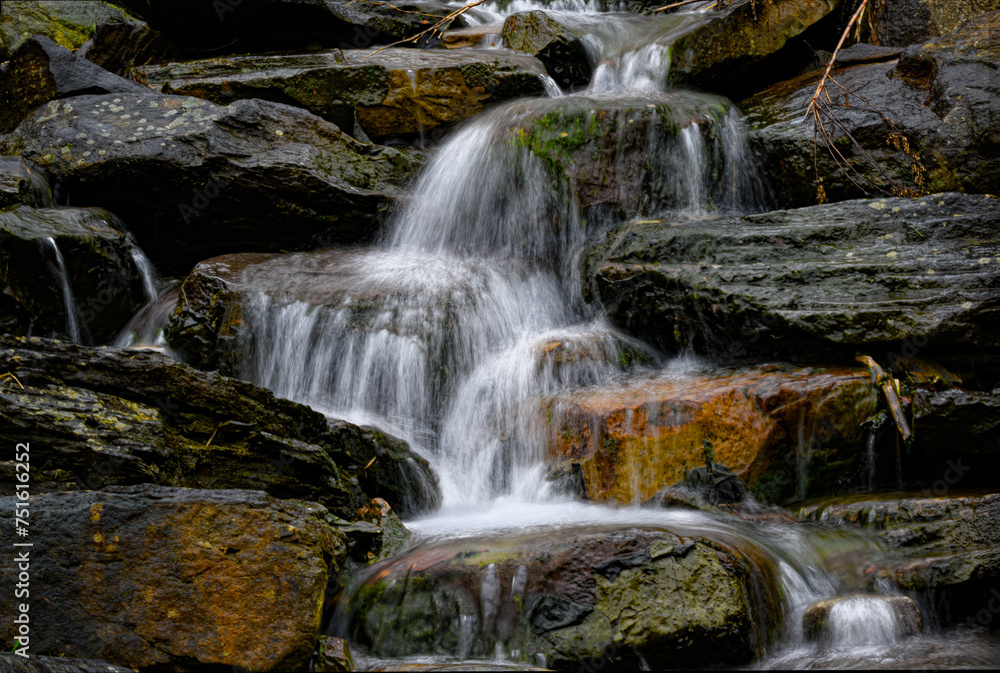 Fototapeta premium Waterfalls at D&H Rail Trail in Forest City PA. Still winter but the Weather was perfect for a hike on the trails through the woods.