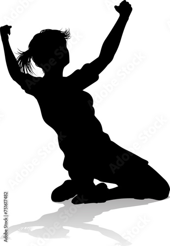 A female soccer football player woman in silhouettes