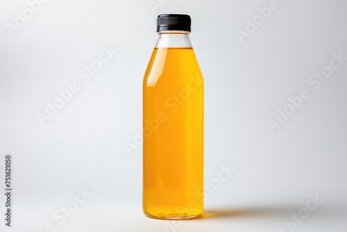Plastic bottle of fresh apple juice on white background isolated