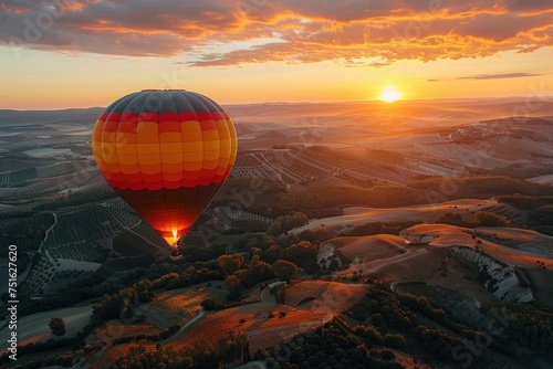 Hot air balloon floating over a misty landscape at sunrise with rivers and fields below. adventure in the skies