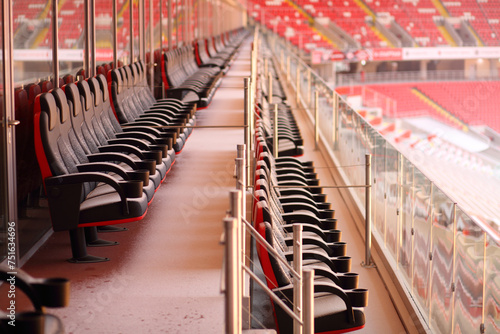  Bright red seats of grandstands covered by snow in new stadium. © Pavel Losevsky