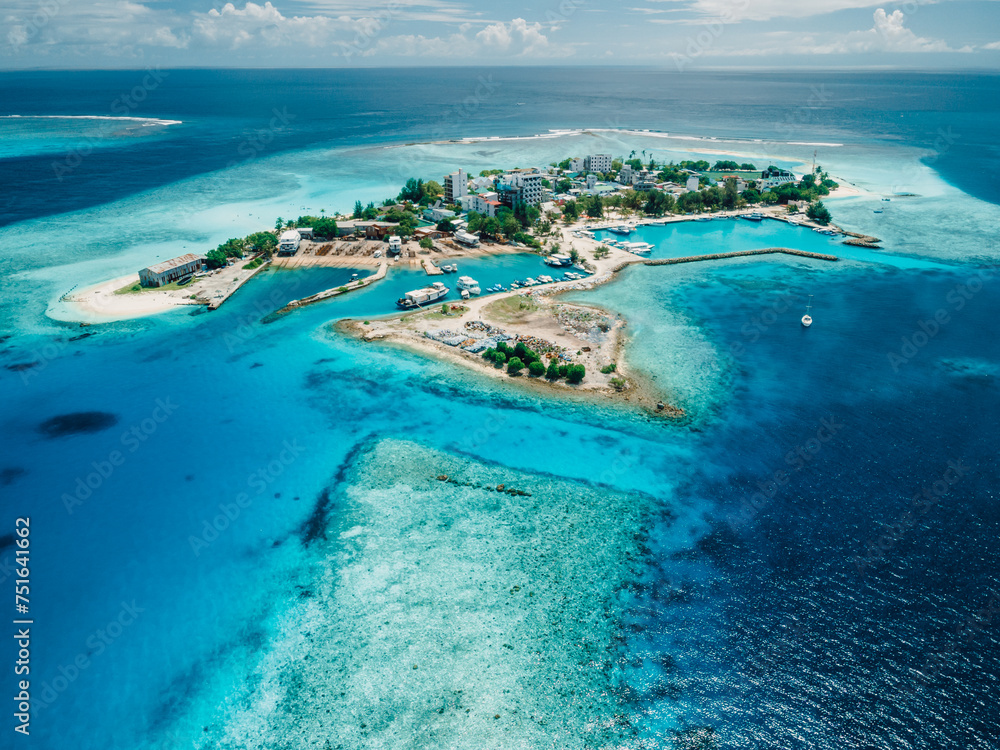Gulhi island near Maafushi on Kaafu Atoll. Local island with blue ocean on Maldives. Aerial View