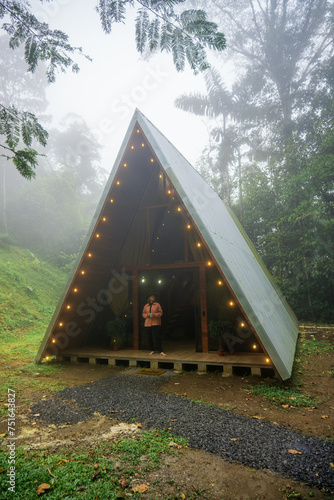 Girl near the A-frame house