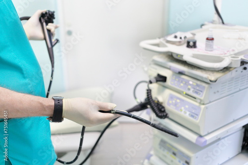 Gastroduodenoscopy distal end and manipulator in the hands of doctors in treatment room photo