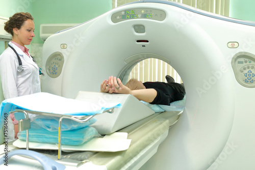 Nurse and patient being scanned and diagnosed on CT  computed tomography  scanner in hospital