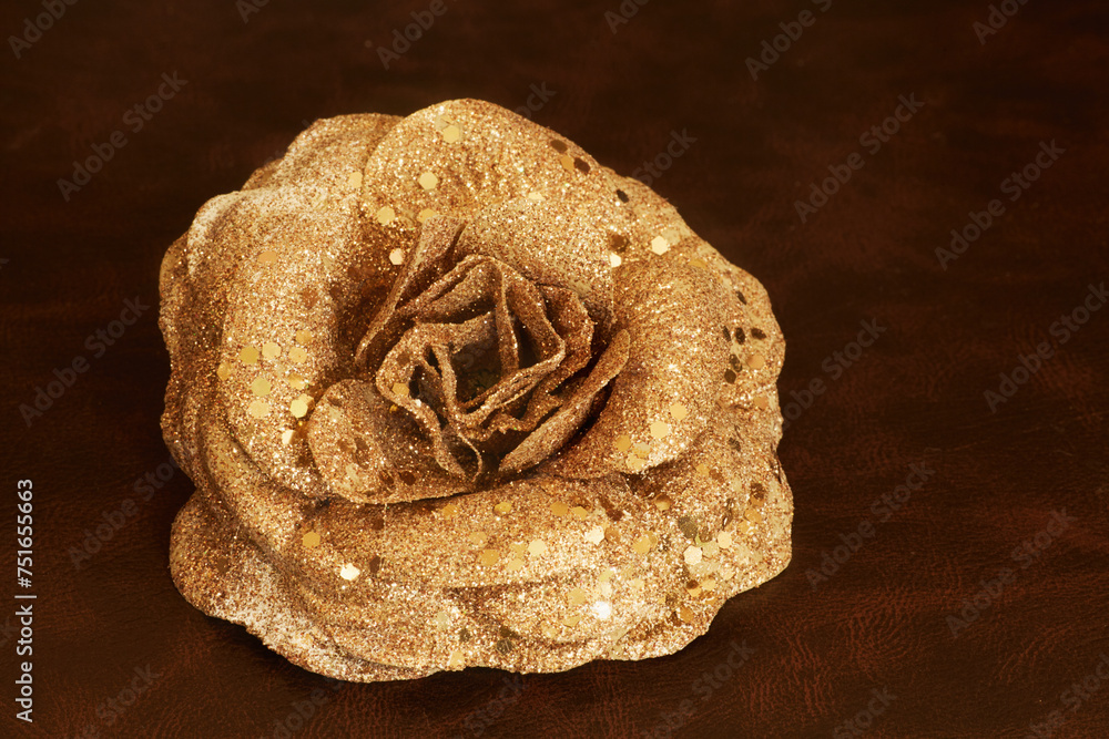 Christmas decoration in shape of rose on leather armchair Christmas decoration in shape of rose on leather armchair