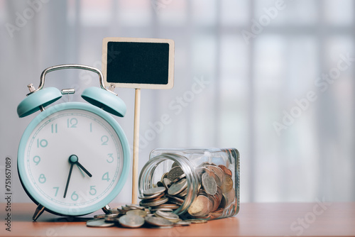 Alarm clock and coins with ...